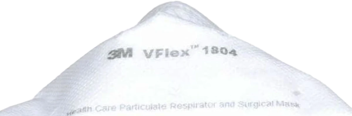 Close-up of the 3M VFlex 1804 respirator nose-bridge showing the adjustable aluminum noseclip