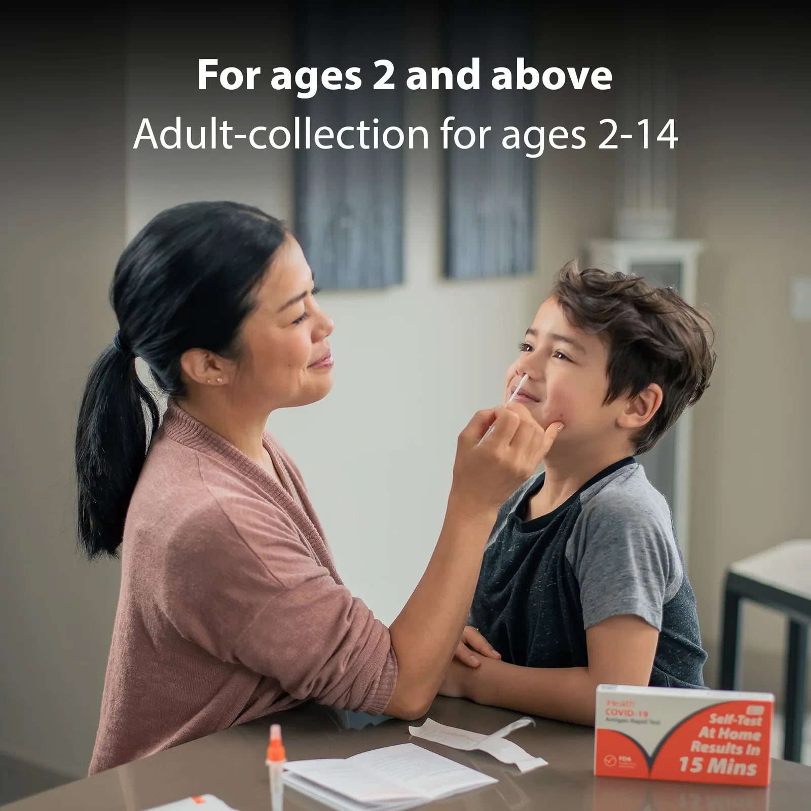 Parent collecting a nasal swab sample from a child with the iHealth COVID-19 home test, for ages 2 and above