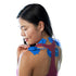 Woman using PowerDot 2.0 Duo electrode pads on shoulders for pain relief